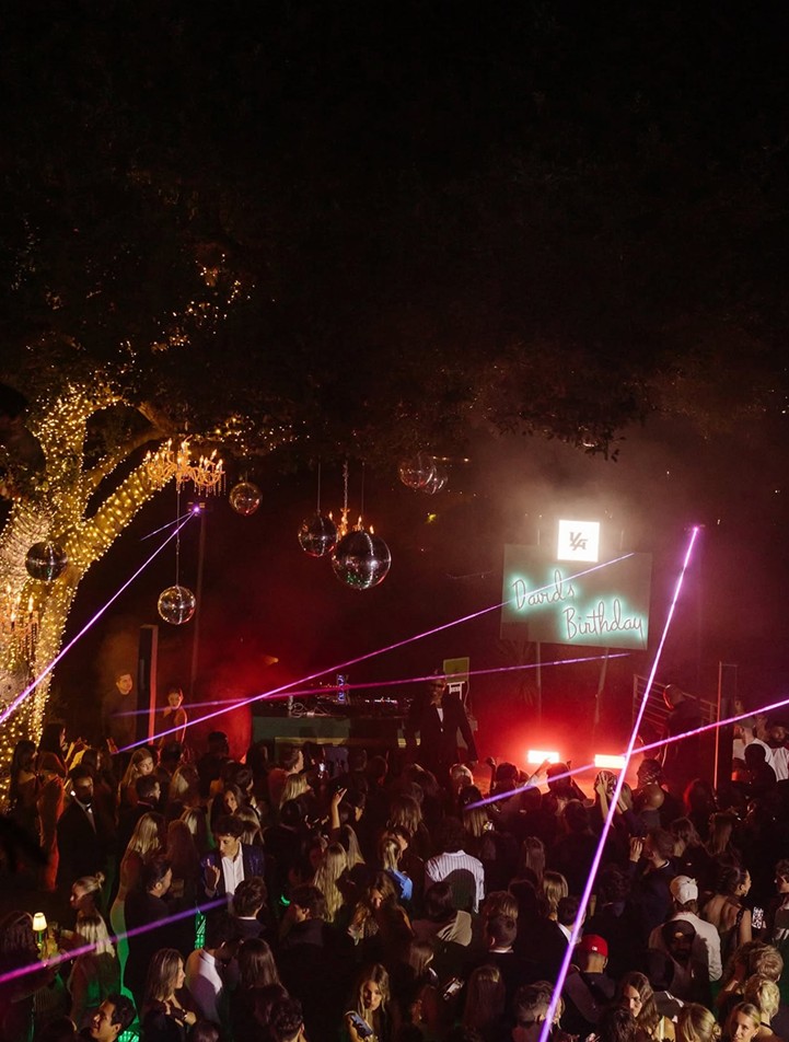 Vibrant party with lights and decorations.